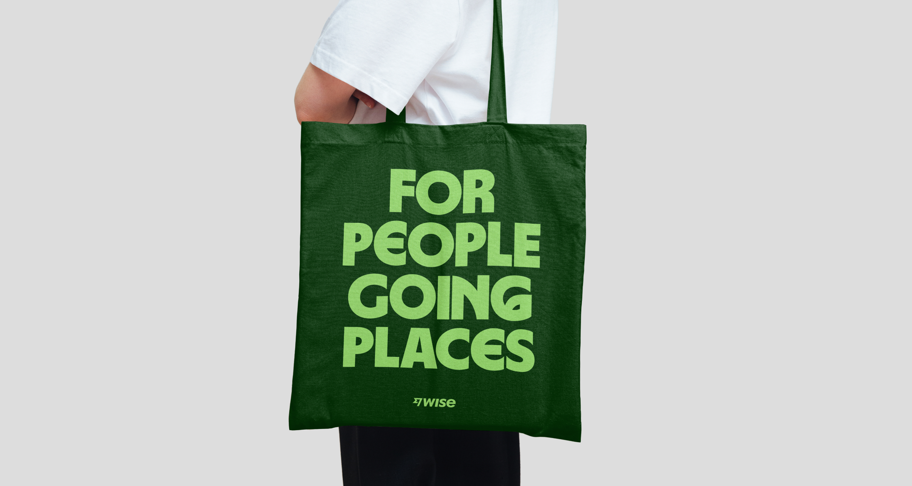 A tote bag showcasing a text only design for Wise Swag.