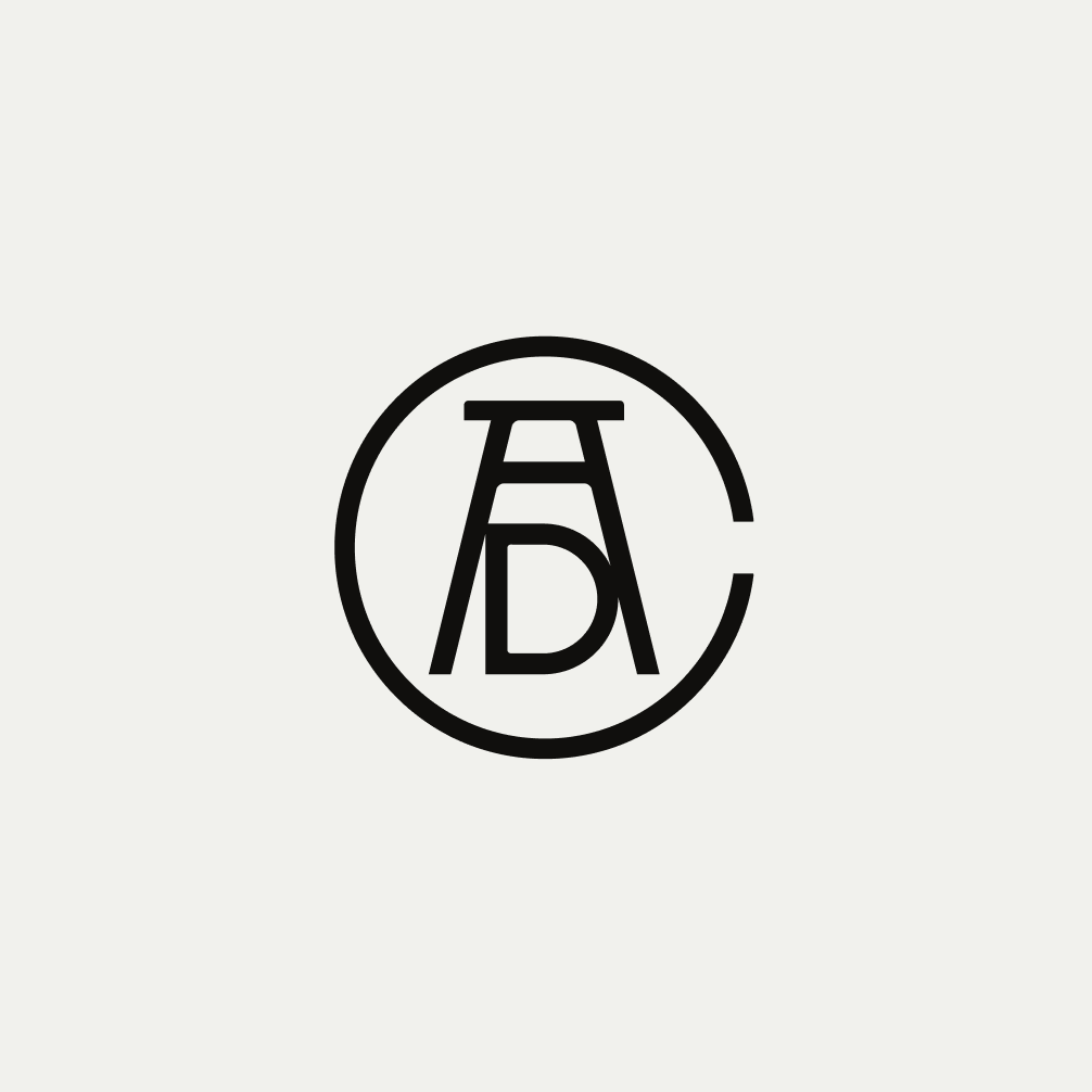 Art Directors Club monogram logo on a gray background