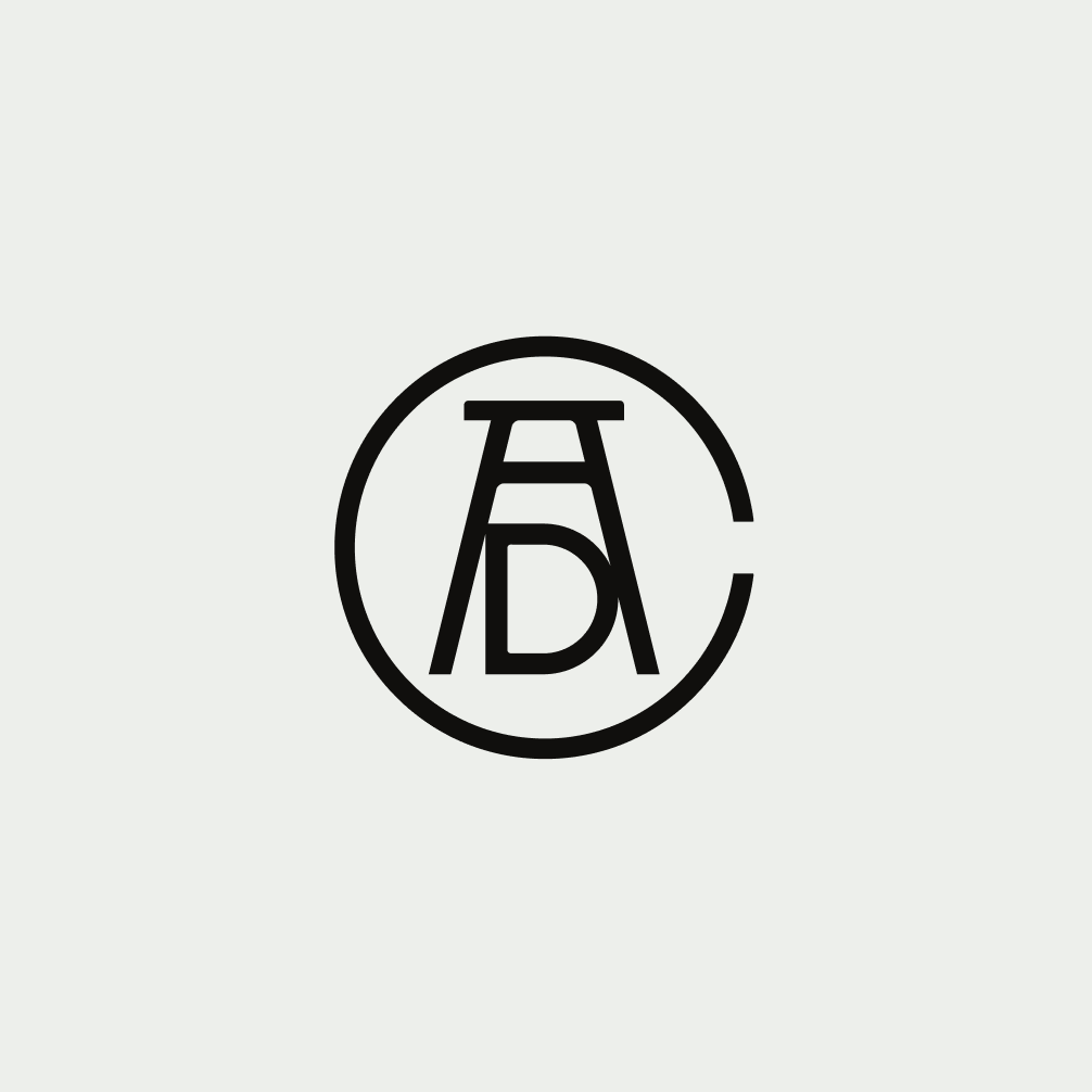 Art Directors Club monogram logo on a gray background