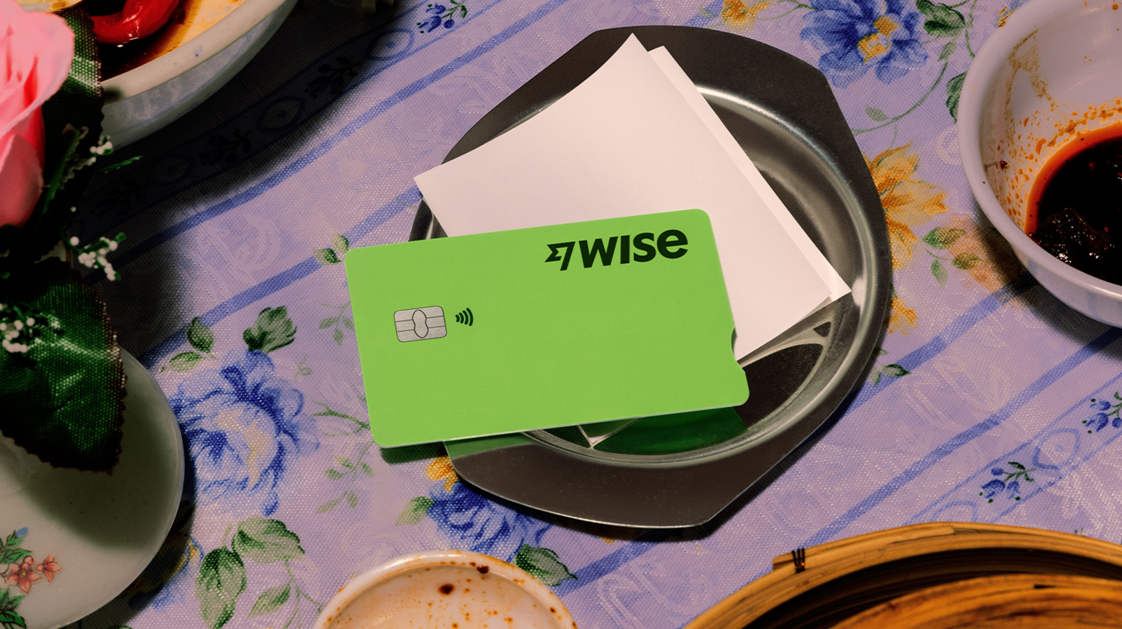 Woman holding a Wise card