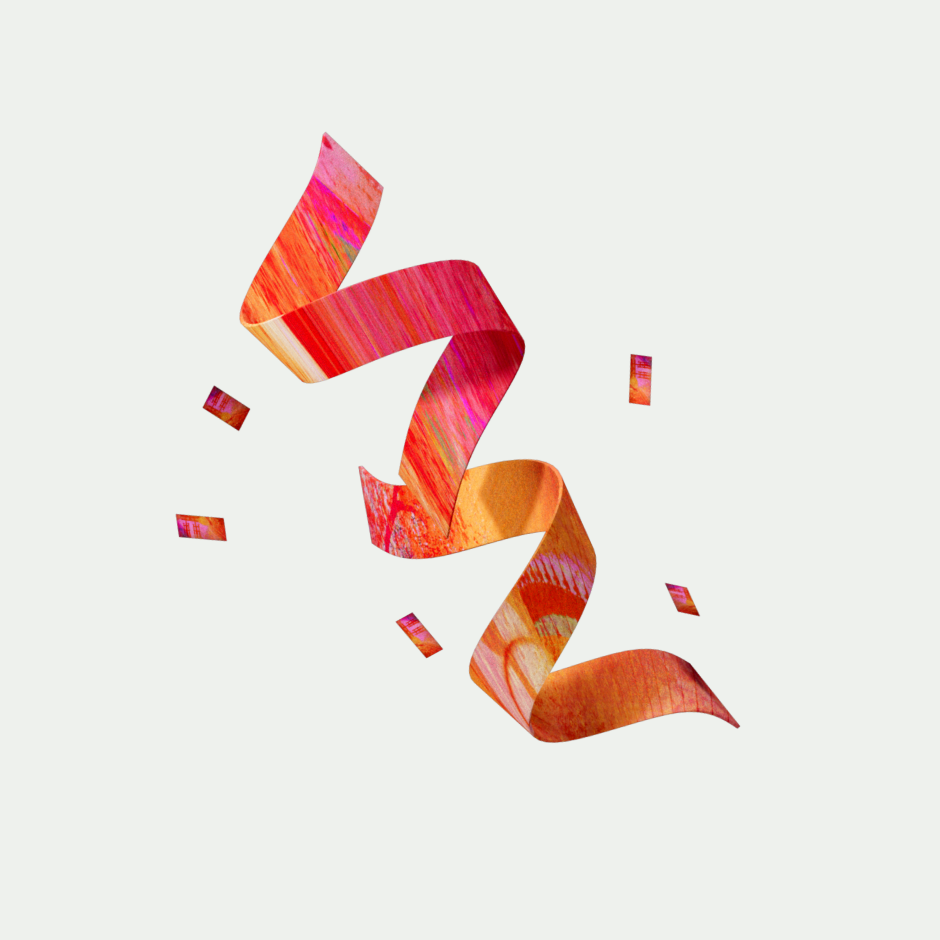 A multi-color twirling ribbon with confetti behind it 